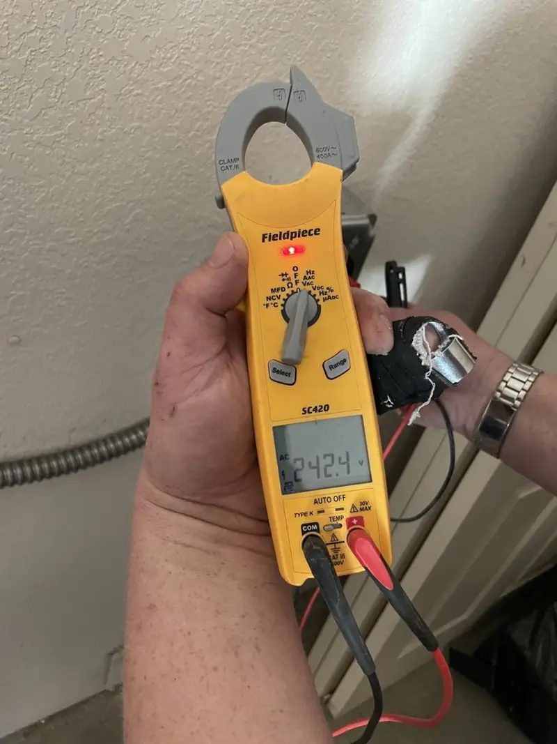 Voltage testing with clamp meter during Whole House Surge Protector in Waterbury